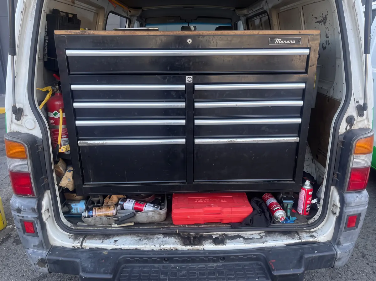 Tool chest and equipment stored inside an open Movin Mobile service van